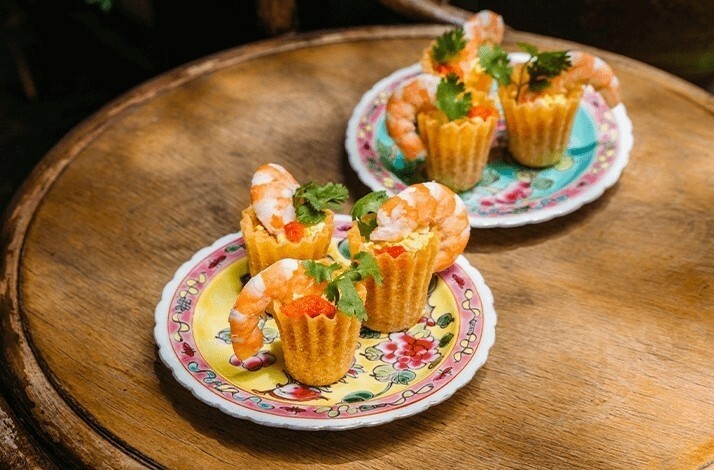 Tartlets with shrimps made by Sophia Yeow, a former contestant on MasterChef Singapore on white plates.