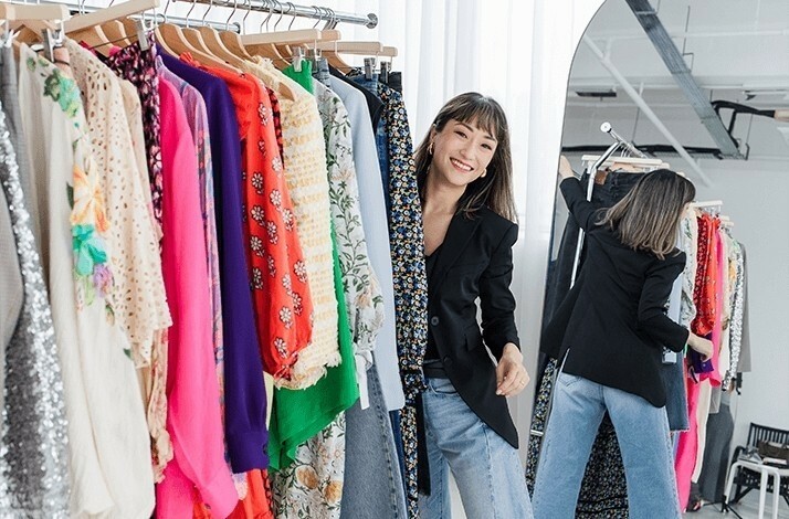Sera Murphy browses through a collection of clothes at The Reoutfitter