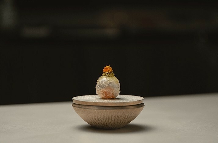 Unusual presentation of dessert Tea Smoked Sakuramasu.