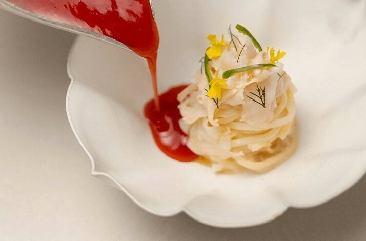 Red yeast rice noodles topped with sauce at ASU.