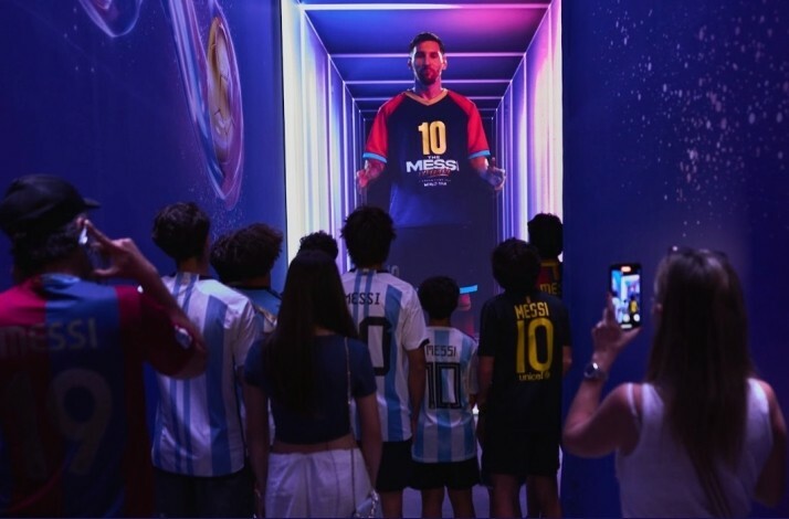 Visitors looking at one of the exhibits at the Messi Experience