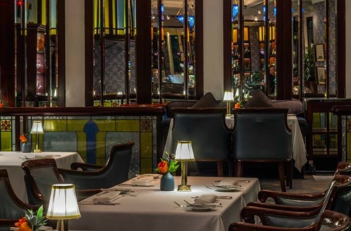Lobster Bar is a typical American steakhouse with wooden tables.