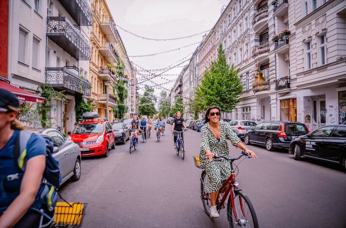 A group of people biking on the streets of Berlin, Germany