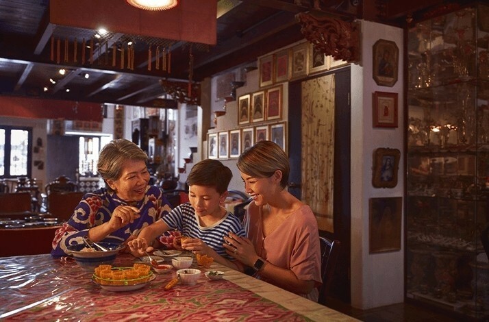People enjoying their food inside Alvin's home.