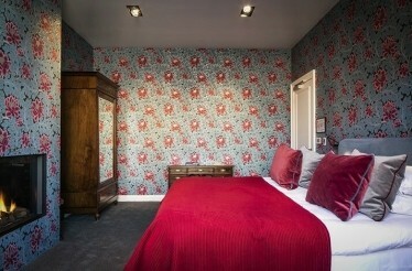 Promotional Poster for QL Hotel de Orangerie with red interior room 