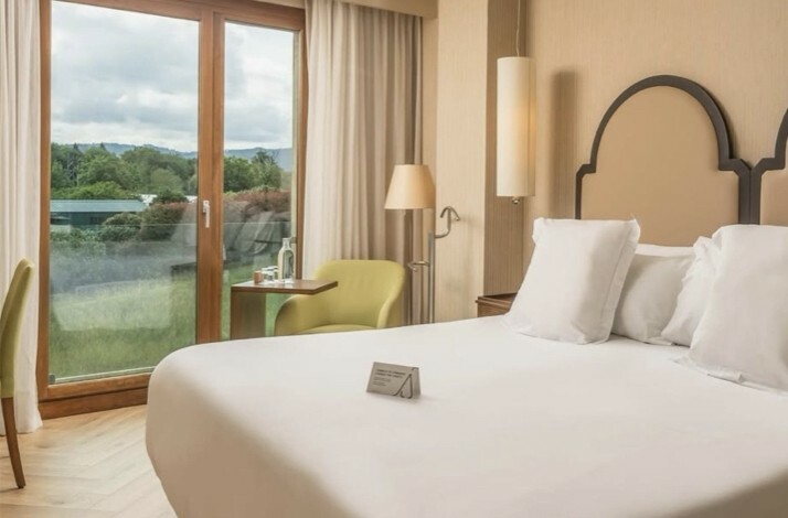 One of the rooms at Hotel ARTIEM Asturias with a large white bed.