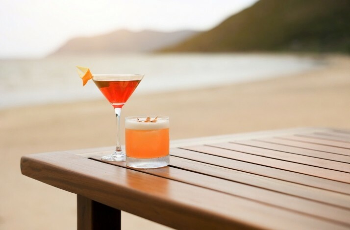 Cocktails on the wooden table on a  Con Dao resort