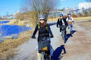 A group of tourists on a guided bike ride in Helsinki, Finland.