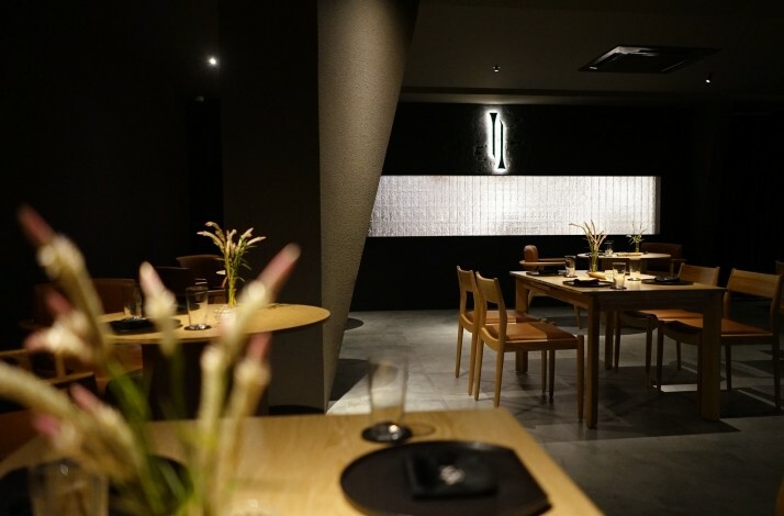 The interior of Nén Danang restaurant in dark colors