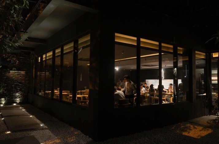 The exterior of Nén Danang restaurant in the night