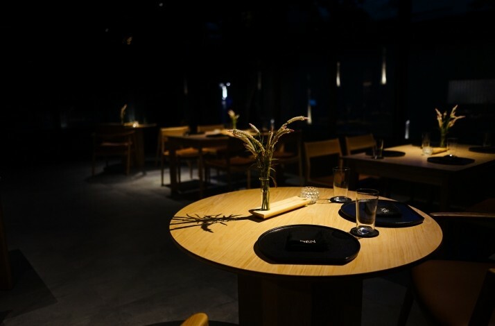 The interior of Nén Danang restaurant in dark colors
