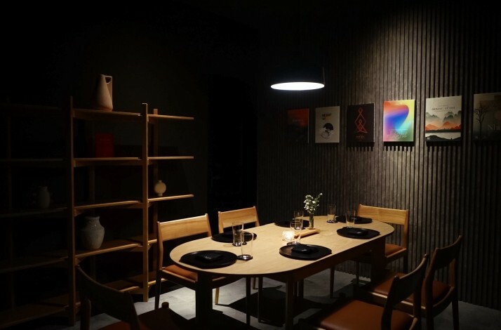 The interior of Nén Danang restaurant in dark colors