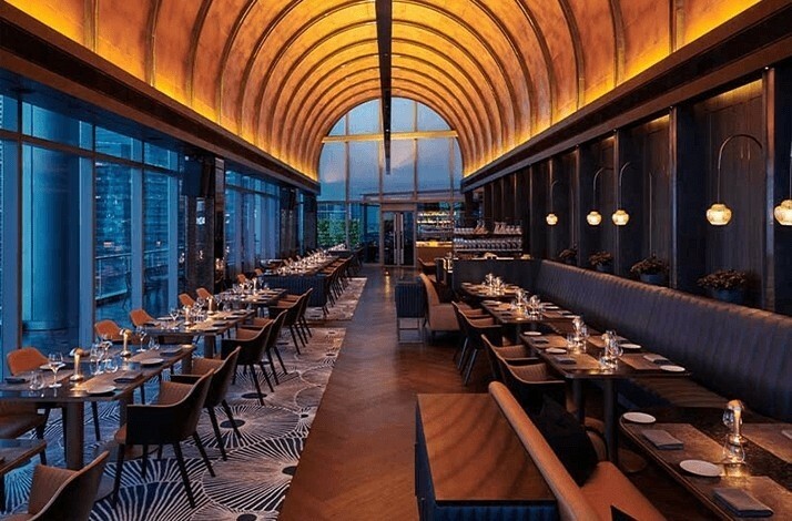 Interior of VUE restaurant with arched ceiling and elegant dining setup.