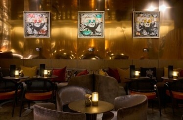 Cozy indoor view of Quin Bar featuring warm lighting and inviting décor.