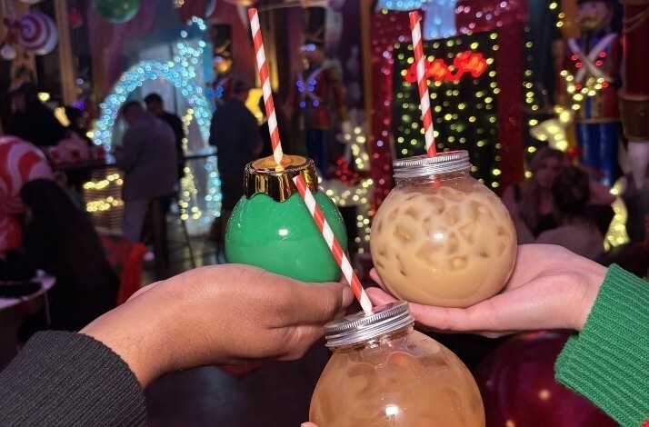 Festive drinks served at Holly Jolly Bar with special Christmas mugs.
