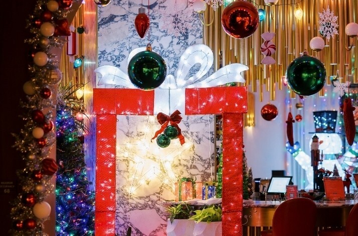 Christmas decorations in the shape of a gift box at Holly Jolly Bar