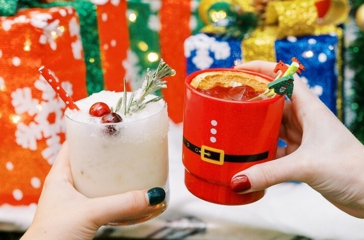 Festive drinks served at Holly Jolly Bar with special Christmas mugs.