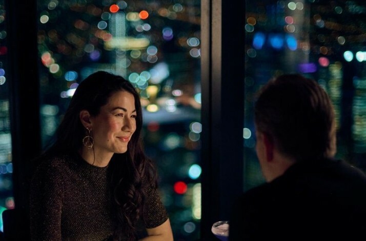 A couple sharing a dinner inside of Eureka Tower at Eureka 89 restaurant