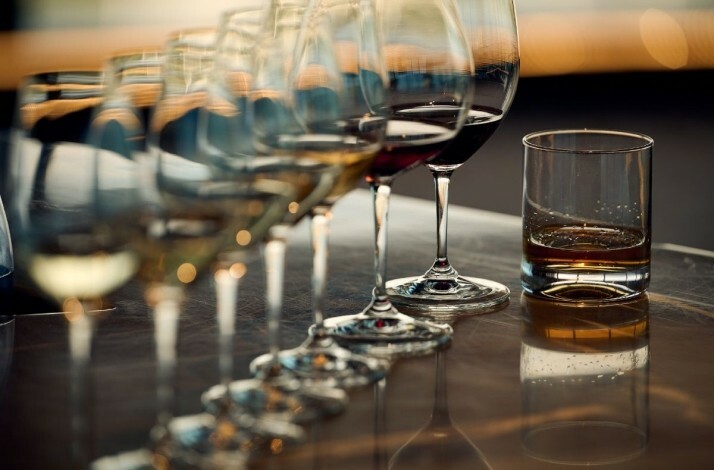 A lot of glasses with different type of wines in row