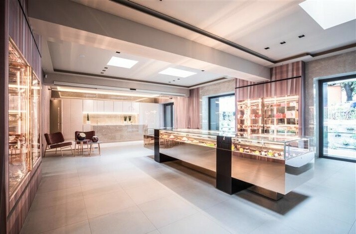 The interior of Italian pastry chef Damiano Carrara's flagship Atelier Damiano Carrara showcases desserts display cases.