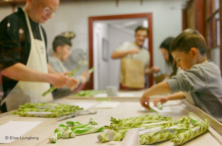 A group of people making handmade candy.  ©Elias Ljunberg