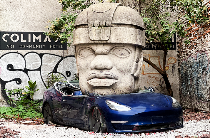 Art installation by the Mexican sculptor Chavis Mármol titled Neo-Ta Meme of a Tesla car with a huge sculpture