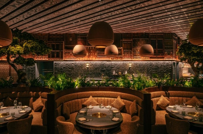 Cozy interior with set tables of HANU restaurant in Dubai.
