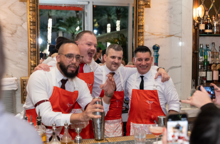 Bartenders at Dante Restaurant gathered for a cheerful group photo.