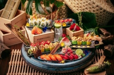 Assorted sushi and sashimi platter with vibrant garnishes at SUSHISAMBA Abu Dhabi.