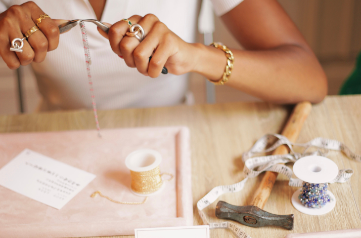 Hands during the process of Jewelry-making workshop in Paris.