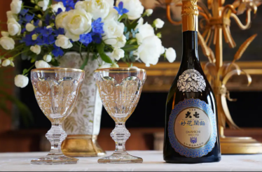 Daishichi sake bottle and tasting glasses for an exclusive sake pairing experience at Odo Lounge.