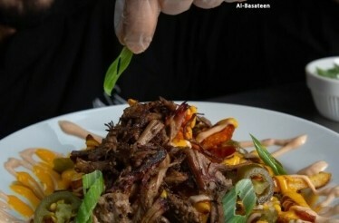 Chef decorating lebanese dish from AMAR Restaurant.