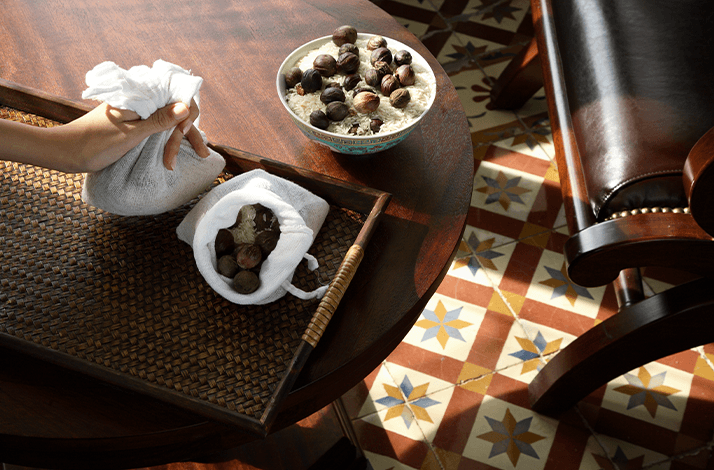 Ingredients and tools for the Nutmeg-Rice Rolling Massage, a warming treatment at Spa Village Malacca.