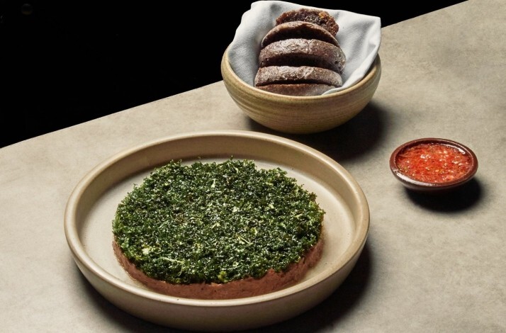 Oda restaurante Bogota — contemporary Colombian plated dish with herb crust, house bread and salsa