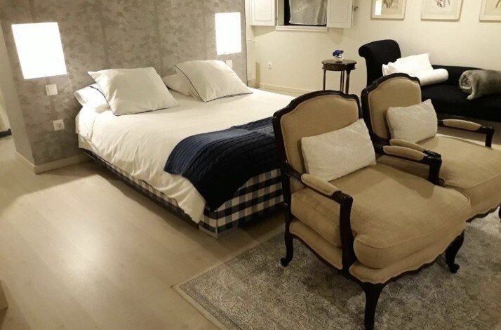 Minimal interior design of room suite at Casa da Cisterna.