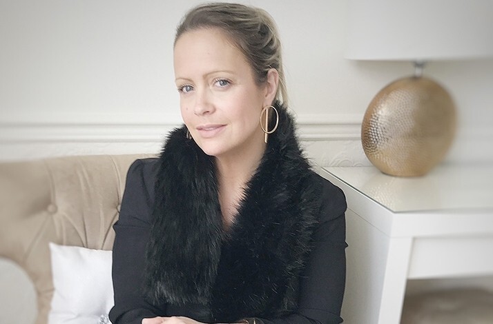 Portrait of fashion stylist Sharon Warten on a sofa
