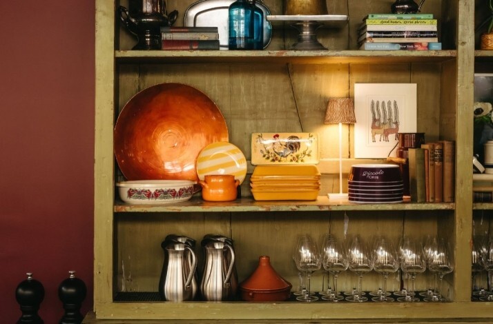 Authentic Italian kitchen utensils displayed on shelves at Piccolo Morini.