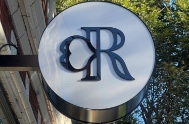 Cantina Rosa cocktail bar logo sign on the venue building.