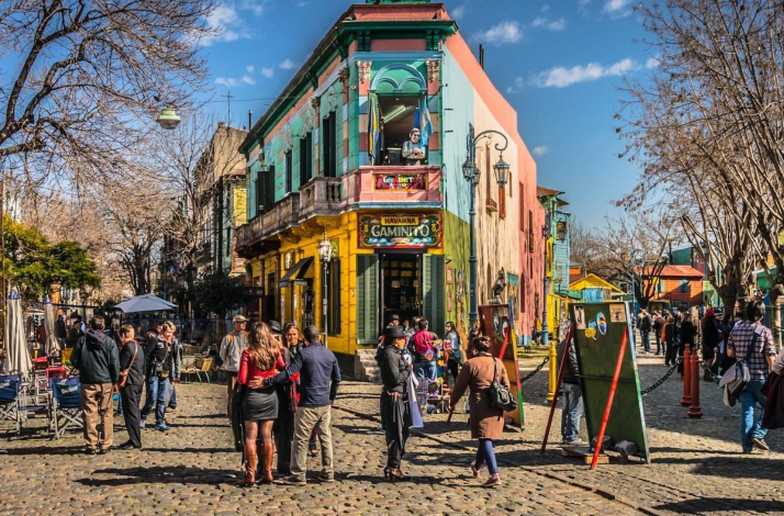 Travelers explore colorful Caminito in La Boca during a guided cultural experience in Buenos Aires.