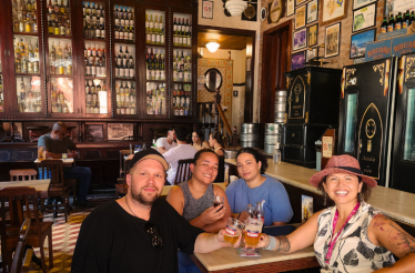 People enjoying the Tour with drinks in a bar in Rio.