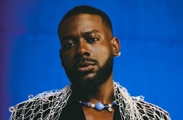 Promotional banner for Adekunle Gold, the globally recognized Nigerian Afropop singer-songwriter.