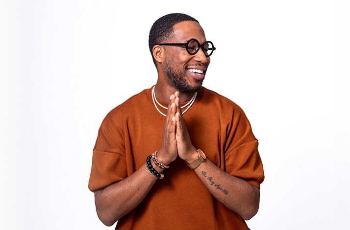 Promotional poster for Cory Henry standing in front of a white background.