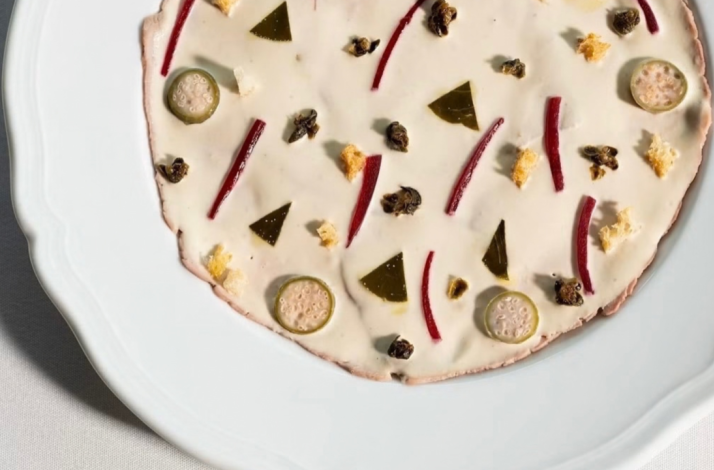 Vitello Tonnato dish served at Seia Miami, featuring cold-sliced veal covered in a creamy tuna sauce.