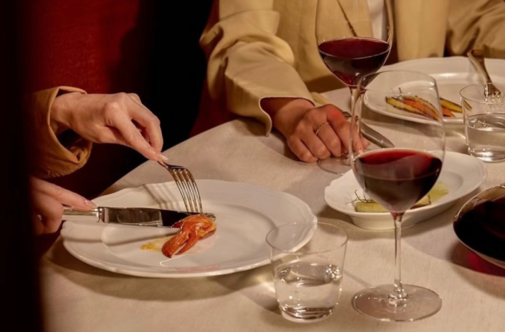 Close-up of diners enjoying appetizers at at Seia Miami.