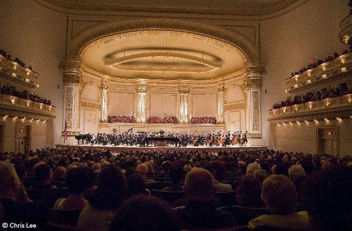 New York Philharmonic performing at Carnegie Hall's Stern Auditorium/Perelman Stage before a capacity audience. © Chris Lee.