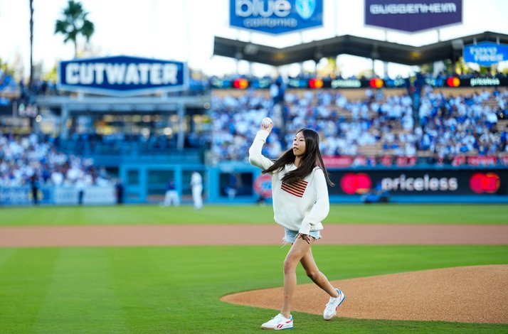 A girl throwing the ceremonial first pitch at a Los Angeles Dodgers™ game