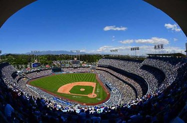 Full bleachers of the Dodger Stadium during a game.