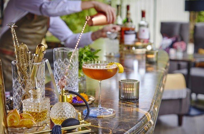 The bartender prepares a variety of drinks for visitors to Hayfield Manor.