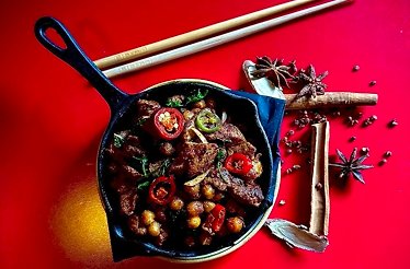 Chinese cuisine dish on the pan at Taste Club event.