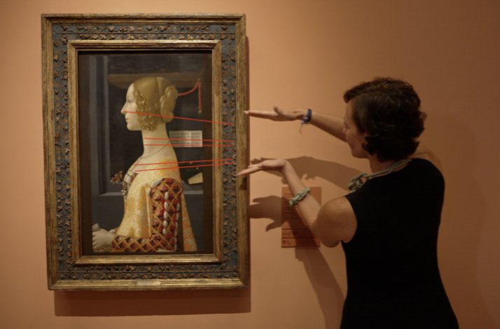 Rocío Rubio Álvarez interacts with a renaissance painting of Ghirlandaio's portrait using lines drawn over the artwork.   